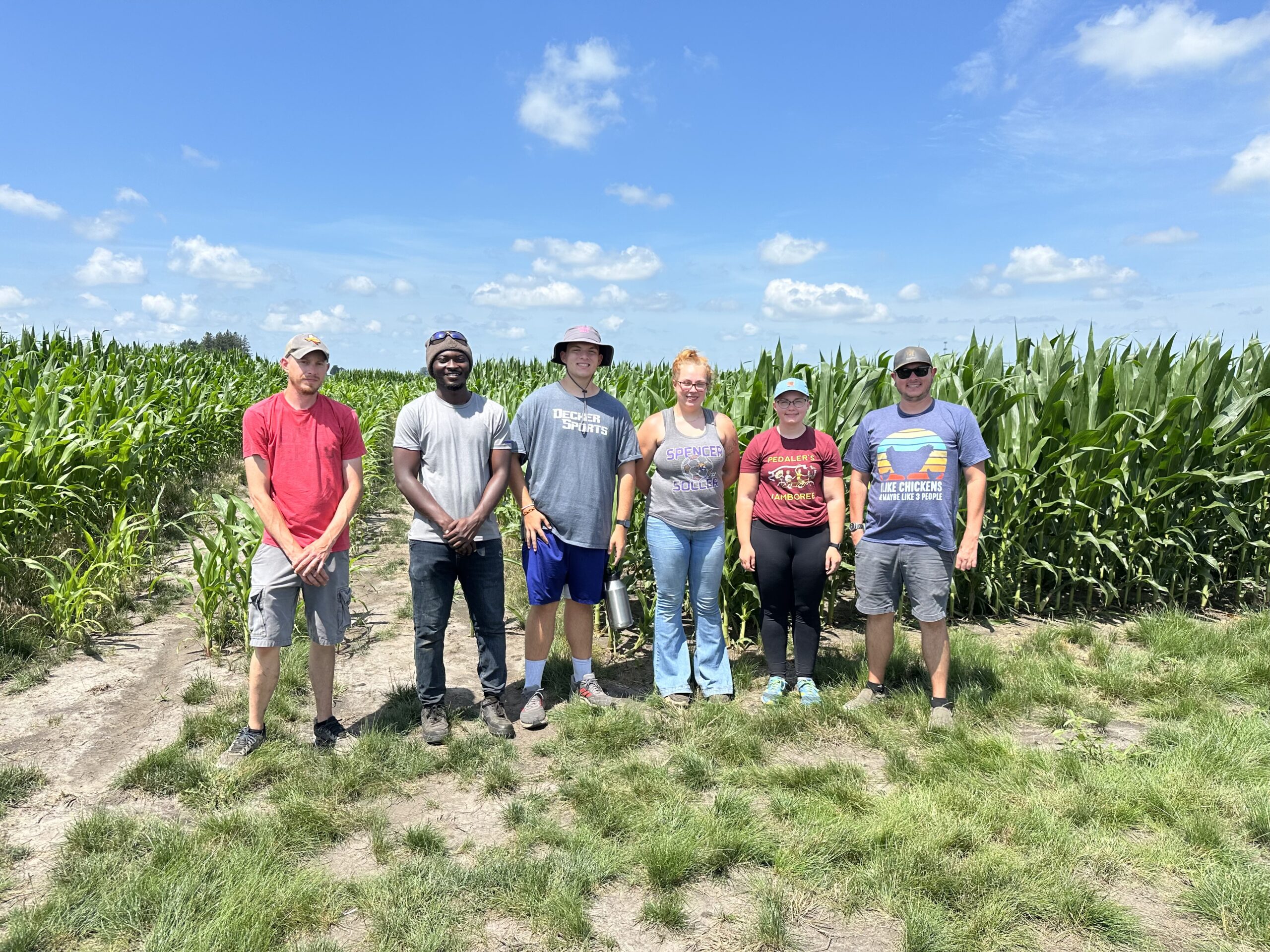 REU participants Jacie Staedtler, Alex Haus and Kylie Buchholz with their research teams.